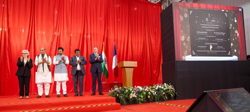 Description: A group of people standing on a stageDescription automatically generated